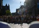 A street entertainer performs on Edinburgh's Royal Mile earlier this month (Picture: Jeff J Mitchell/Getty Images)