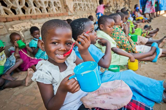 Child in Malawi receiving Mary's Meals.