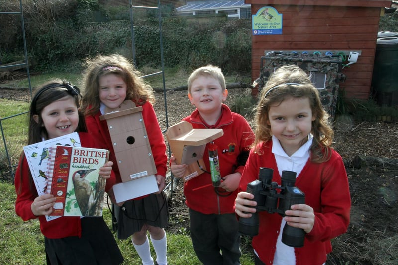 Sanchia Wardle, Amy Checkley, Ryan Cocking and Patrycja Malik check out newbird watching equipment for Hasland infant schoo in 2010