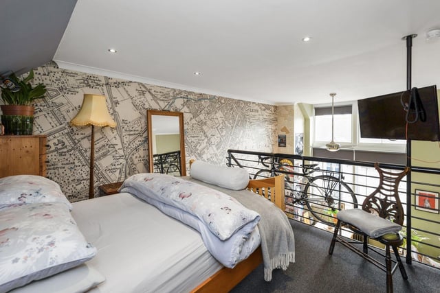 The main bedroom space is beautifully situated atop an impressive mezzanine, with an en-suite shower room and large, walk- in wardrobe neatly positioned upon the mezzanine floor.