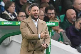 Hibs boss Lee Johnson gestures from the sidelines during the 6-1 defeat by Celtic
