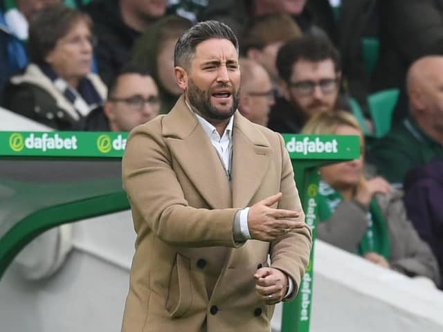 Hibs boss Lee Johnson gestures from the sidelines during the 6-1 defeat by Celtic