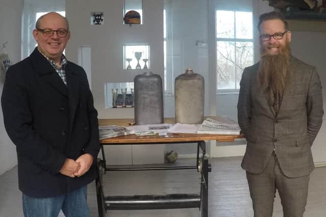 John Lawson, City of Edinburgh Council's Archaeologist and Nicolas Boyes Conservation Consultant with the resealed 1898 capsule and the new 2022 capsule