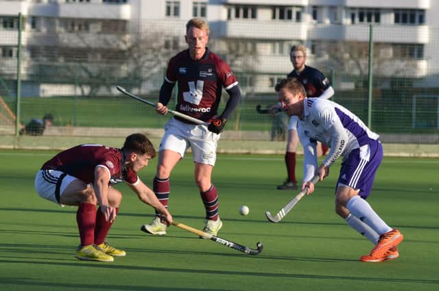 Derek Salmond attempts to pass a Strathclyde University player in Inverleith's 3-0 Scottish Cup win at Mary Erskine School on Saturday. Picture: Nigel Duncan
