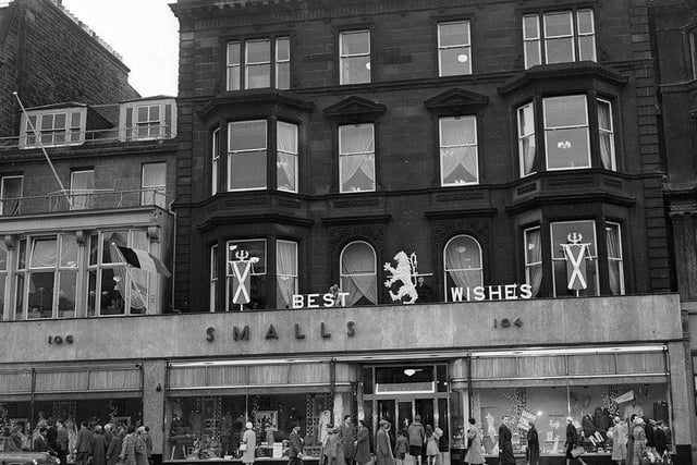 Smalls department store, owned by House of Fraser, closed its doors in 1977. In this photo, you can see a Royal wedding best wishes sign above the store, in 1960.
