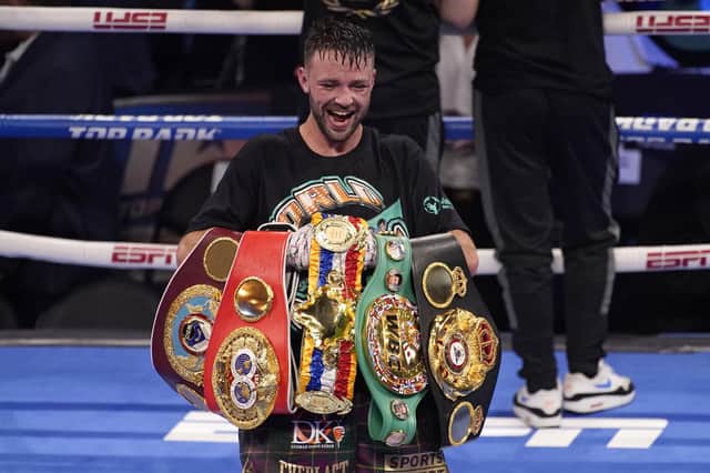 Josh Taylor celebrates while holding his belts after defeating Jose Ramirez by unanimous decision in a junior welterweight title boxing bout Saturday, May 22, 2021, in Las Vegas.