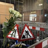 Flowers left on a fence at Edinburgh's Jenners building in memory of firefighter Barry Martin (Picture: Dan Barker/PA Wire)