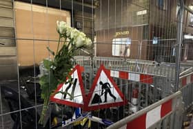 Flowers left on a fence at Edinburgh's Jenners building in memory of firefighter Barry Martin (Picture: Dan Barker/PA Wire)