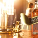 FTSE-100 drinks company Diageo has a vast portfolio that includes Johnnie Walker whisky, pictured, Guinness stout and Smirnoff vodka.
