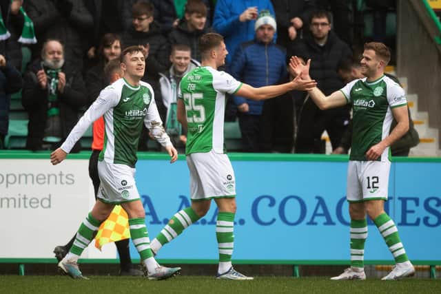 Will Fish celebrates with Josh Campbell (left) and Chris Cadden (right) after opening the scoring for Hibs at Easter Road. Picture: SNS