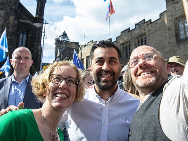 Scottish Green leaders Lorna Slater and Patrick Harvie on the march with Humza Yousaf