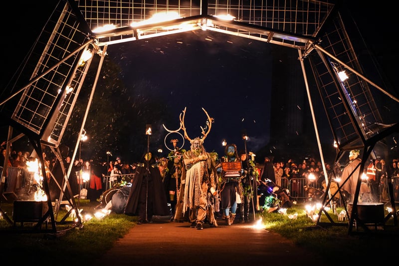 The Green Man passes through the fire arch to enter the underworld. Photo: Andy Buchanan / AFP via Getty Images