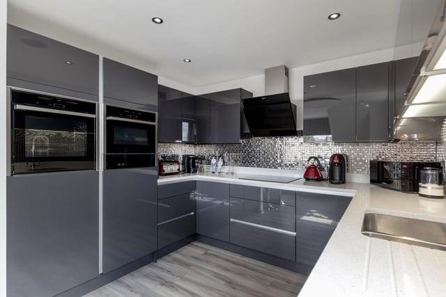 The kitchen section of the main open plan space comes with luxury fitted units and provides access to the wonderful roof terrace.