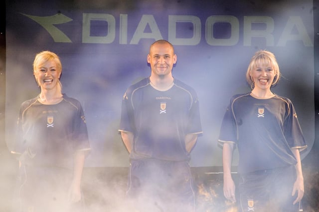 A flash Diadora kit launch in March 2007, with Nigel Quashie and two models. The midfielder won 14 caps from 2004 to 2006, but didn't wear the shirt on the pitch again after this luanch