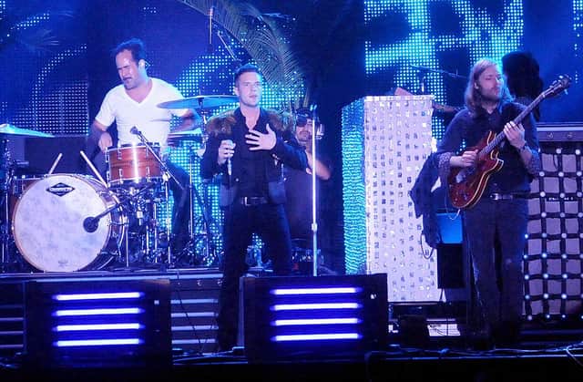 CHICAGO - AUGUST 09: Ronnie Vannucci Jr., Brandon Flowers and Mark Stoermer of The Killers perform during the 2009 Lollapalooza music festival at Grant Park on August 9, 2009 in Chicago, Illinois. (Photo by Jeff Gentner/Getty Images)