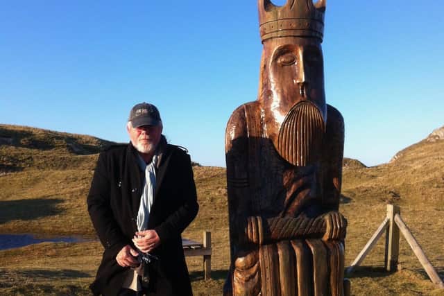 Peter May on Lewis with a model of one of the famous 12th century Chessmen which were found on the island, after which one of his bestselling Lewis Trilogy books is named.