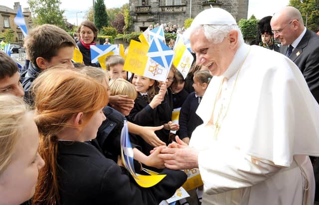 Pope Benedict made a point of greeting children when he went among the crowds.  Arriving at the Archbishop's house in Morningside for lunch, he surprised everyone by going back out to the street for a walkabout.  Pupils from St Peter's RC Primary were there to sing and cheer but got an unexpected close encounter with pontiff when he came over, blessed two of the pupils, shook hands with about ten others and even kissed a neighbour's baby.