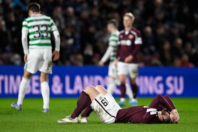 EDINBURGH, SCOTLAND - JANUARY 26: Hearts' Craig Halkett suffers an injury during a cinch Premiership match between Hearts and Celtic at Tynecastle Park , on January 26, 2022, in Edinburgh, Scotland. (Photo by Rob Casey / SNS Group)