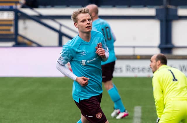 Gary Mackay-Steven wheels away after opening the scoring for Hearts. Picture: SNS
