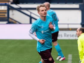 Gary Mackay-Steven wheels away after opening the scoring for Hearts. Picture: SNS