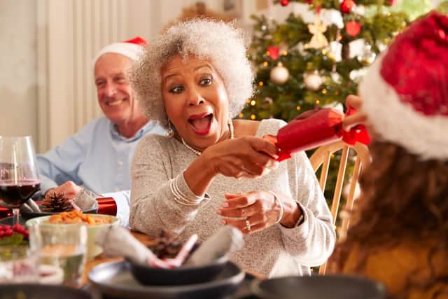 Crackers are a staple of Christmas dinner celebrations in the UK (Shutterstock)