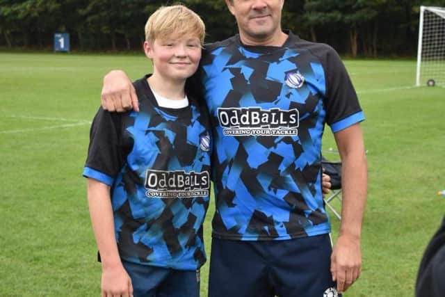 Darren McMillan and his son Kyle, 14, a keen touch rugby player.