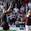 Hearts' Peter Haring looks shocked as he is sent off by referee David Dickinson at St Mirren.