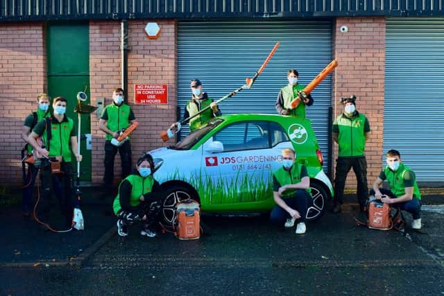 Gardeners showing off their new eco-friendly kit