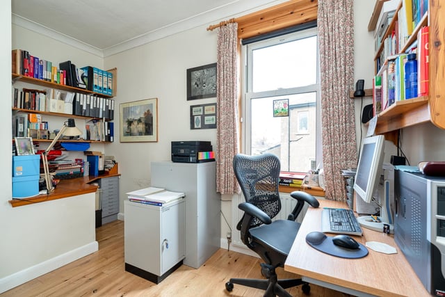 The smaller double bedroom is currently in use as a peaceful home office.