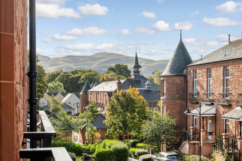 The property enjoys spectacular views from the upper floor across the development to the Pentland Hills.