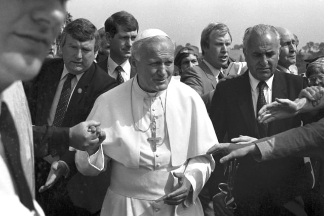 Security is tight but well-wishers manage to touch Pope John Paul II shortly before his departure from Turnhouse Airport.
