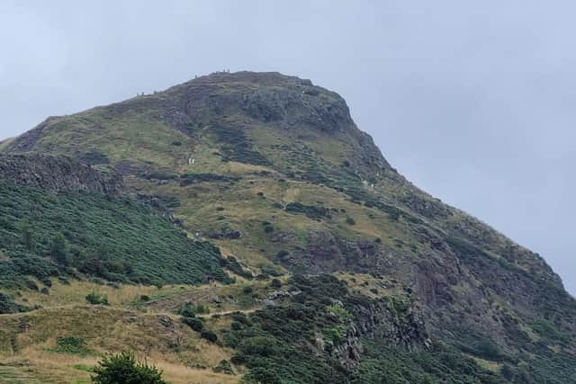 Man arrested after woman falls to her death from Arthur's Seat