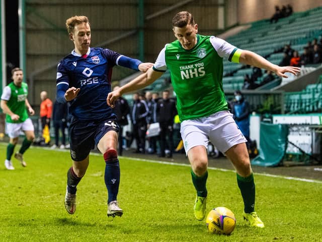 Hibs defender Paul Hanlon and Harry Paton of Ross County battle for the ball during the last meeting between the two teams