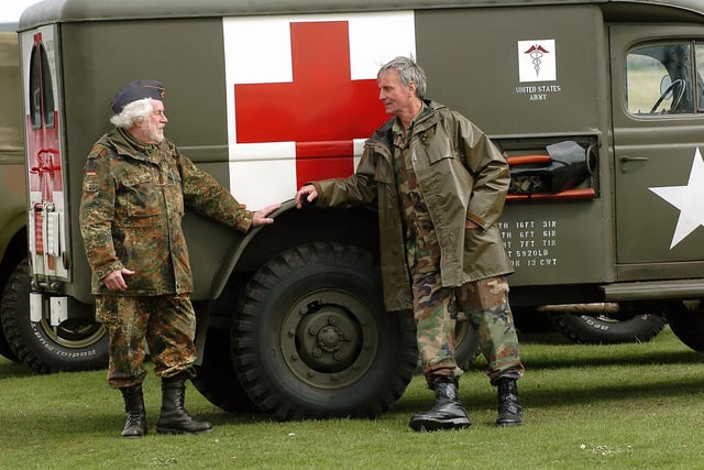 2006. The World at War held at the Royal Armouries Fort Nelson. (left) Michael Halfpenny (74) from Bognor with (right) Andrew Reinhardt (64) also from Bognor beside a 1944 Dodge Ambulance. Picture: Malcolm Wells 61691-195
