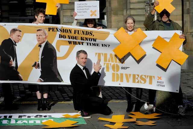 John Hardy (front) and other climate activists from campaign group Divest Lothian outside Edinburgh City Chambers    Photograph: Colin Hattersley