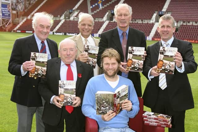 Leslie Deans (second from the left) and Gary Mackay (far right) at Tynecastle Park in 2005 to promote the launch of a new club book. Picture: SNS