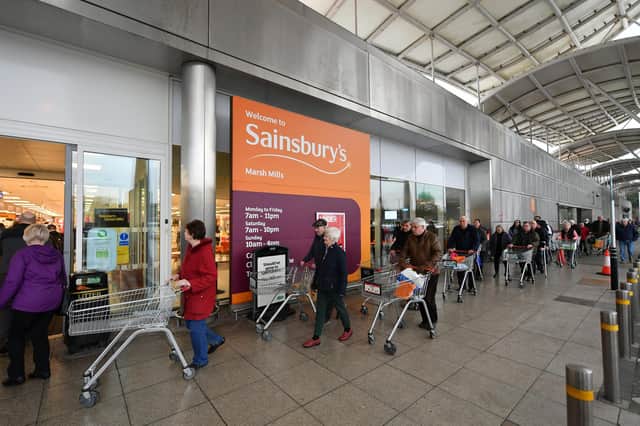 Shoppers queue outside a Sainsbury's supermarket during the early stages of last spring's lockdown. Picture: Dan Mullan/Getty Images