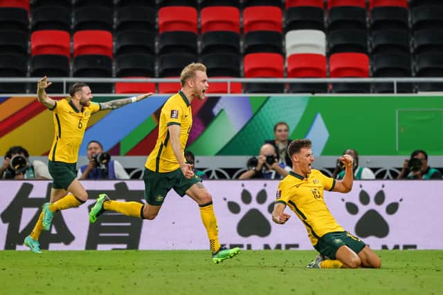 Left - right: Boyle, Atkinson, and Ajdin Hrustic celebrate Australia's winner