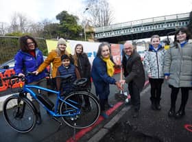 Transport convener Lesley Macinnes and Active Travel Minister Patrick Harvie break the ground on the new cycle link along with pupils from Roseburn Primary School. Picture: Greg Macvean