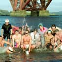 Men and women in the Firth of Forth at South Queensferry, taking part in the Loony Dook for charity on 1 of January 1993.