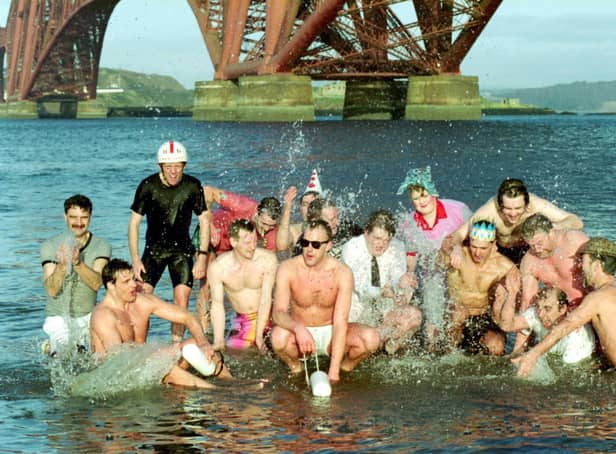 Men and women in the Firth of Forth at South Queensferry, taking part in the Loony Dook for charity on 1 of January 1993.