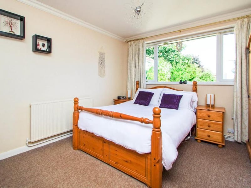 Time to take a look at the property's bedrooms. Here's the nice and neat first one, with plenty of wardrobe storage.
