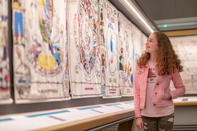 CBeebies actress Mimi Robertson from Selkirk (Molly from Molly and Mack) has a closer look at the Great Tapestry of Scotland. Picture: Phil Wilkinson