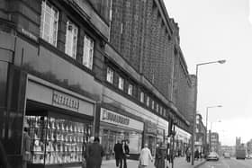 Shops at the top of Edinburgh's Lothian Road  in December 1974, including Woolworths and Jeffreys household furnishings.