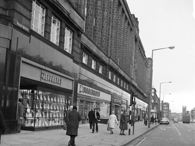 Shops at the top of Edinburgh's Lothian Road  in December 1974, including Woolworths and Jeffreys household furnishings.