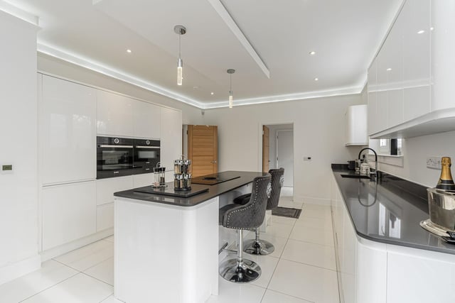 The sleek dining/ kitchen is fitted with a superb assortment of stylish units with contrasting worktops, tiling to floors and top quality integrated appliances.