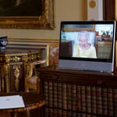 Queen Elizabeth II appears on a screen via videolink from Windsor Castle, where she is in residence, during a virtual audience at Buckingham Palace.