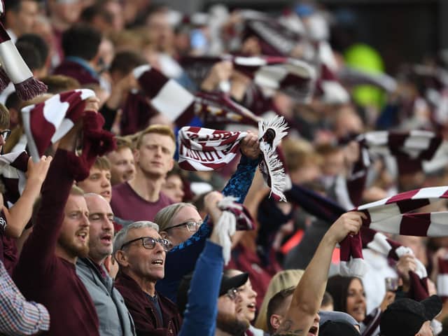 Most football supporters prefer to hold their scarves outstretched above their heads, like Hibs and Celtic. Hearts supporters, however, prefer to grip both ends together and twirl in the air. It's an impressive sight when thousands are doing so in unison.