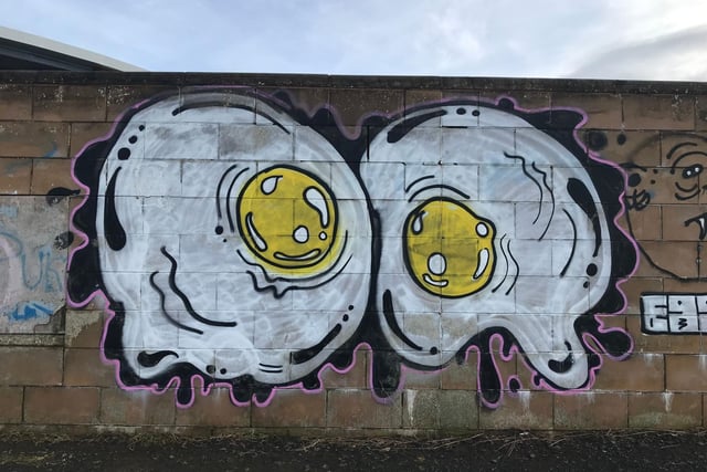Amidst the various graffiti tags on The Western Harbour Promenade in Newhaven, there is one unusual colourful contribution. The enormous fried eggs are certainty something you don’t see every day.