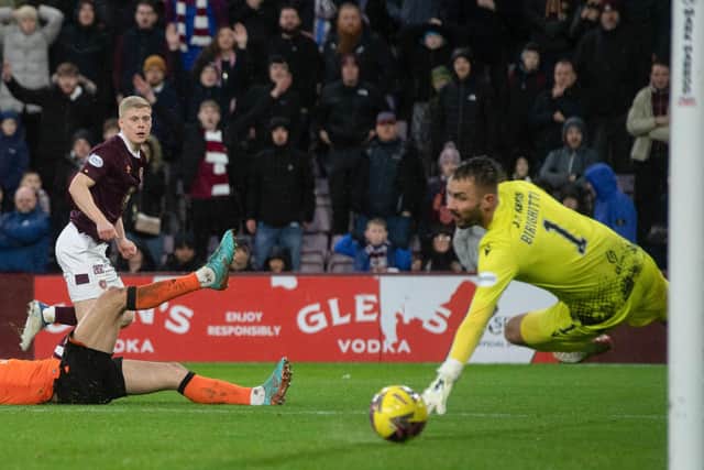Alex Cochrane scoring against Dundee United in February, one of only three wins Hearts have had in their last ten games. Picture: SNS